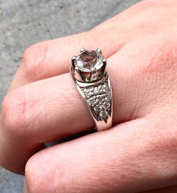 Smoky Topaz ring worn on middle finger, paired with neutral-toned nails for a chic everyday style.