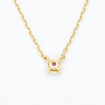 Solid 14k Yellow Gold necklace set with Natural Ruby July birthstone, in a dainty round cut, and prong setting. A perfect necklace gift idea for anniversaries, and july birthdays.