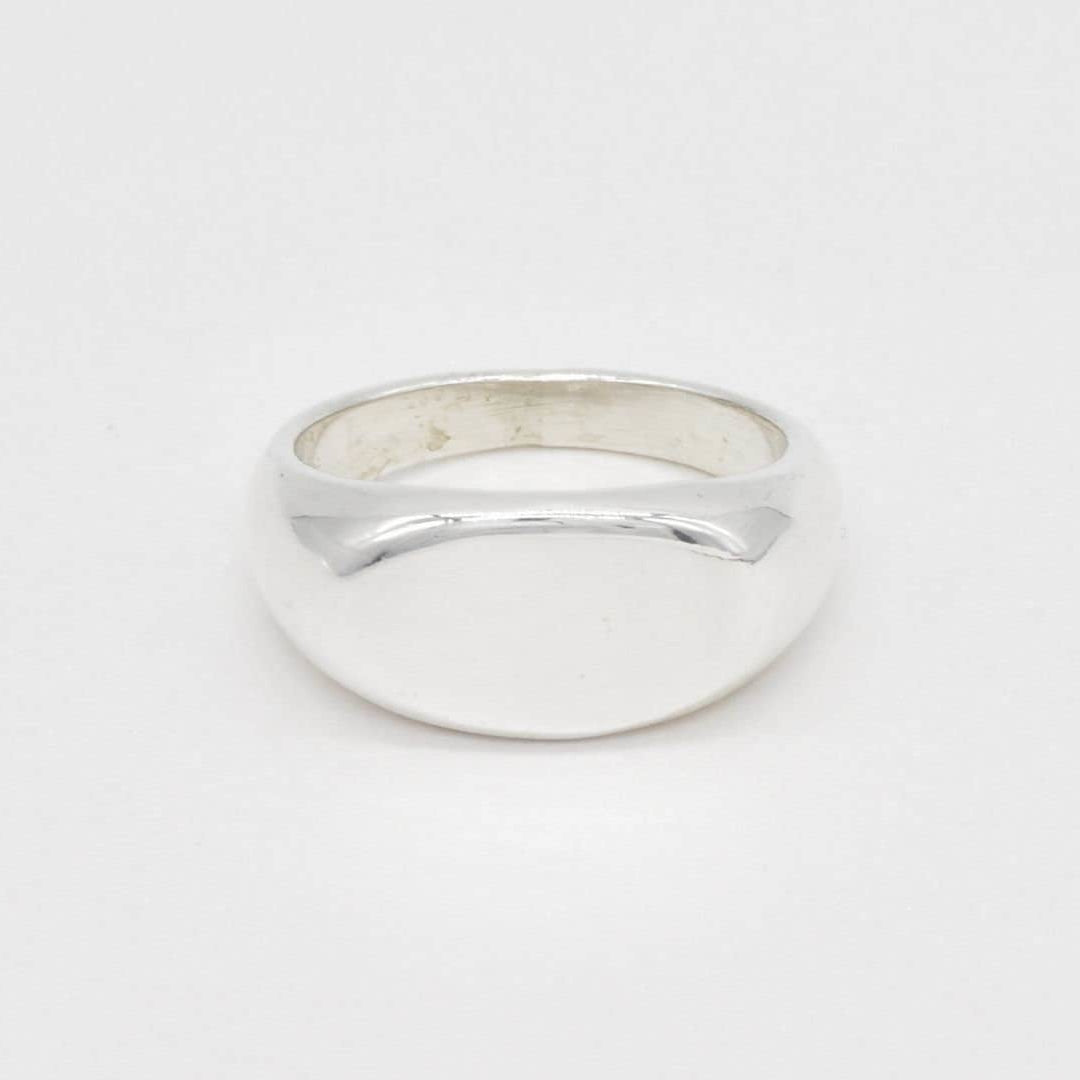 Front view of a solid 925 sterling silver band ring featuring a high-polish, domed surface.