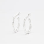 Front view of solid 925 sterling silver hoop earrings on a white background
