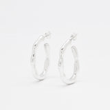 Front view of solid 925 sterling silver hoop earrings on a white background