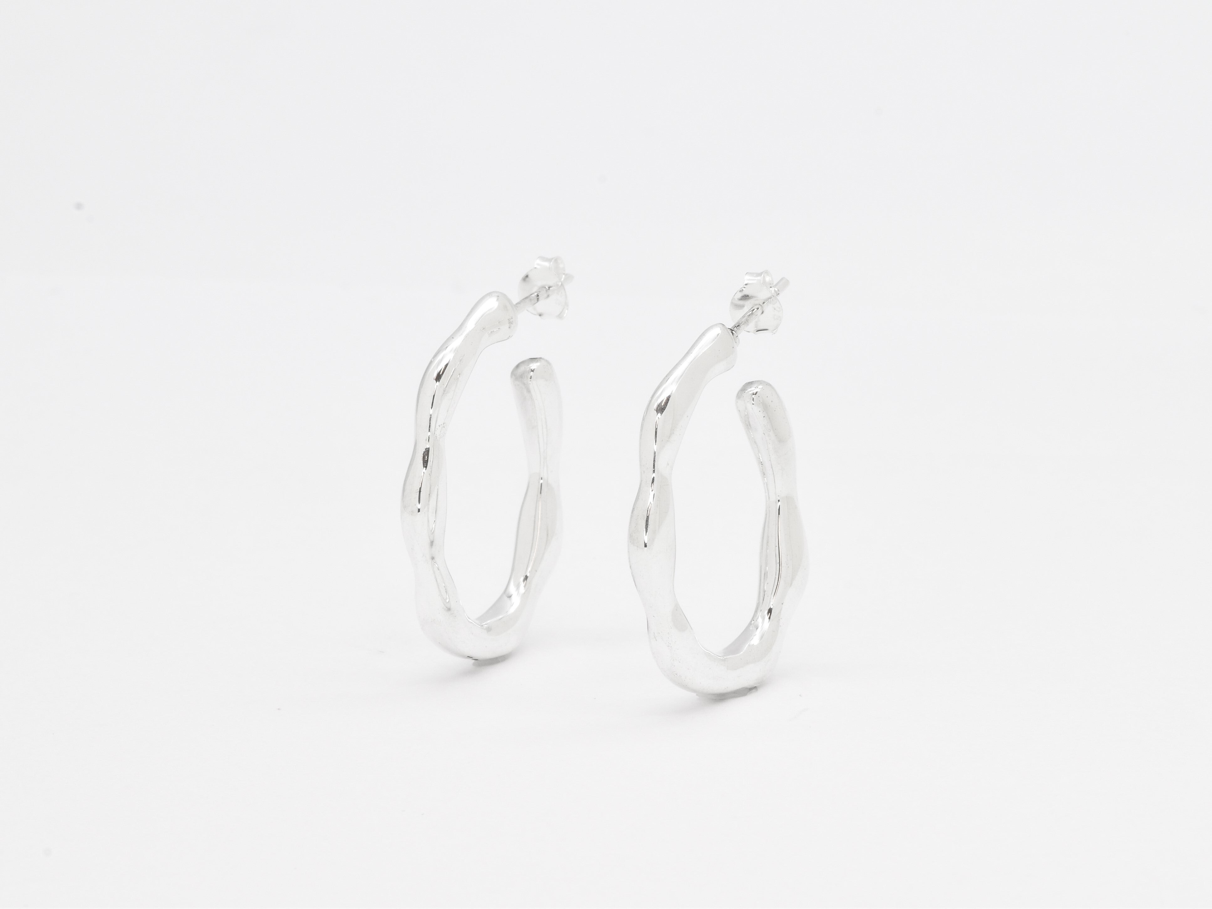 Front view of solid 925 sterling silver hoop earrings on a white background