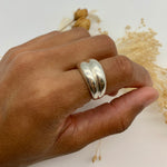 Solid 925 sterling silver ring worn on hand, showcasing its bold, elegant design and shine.