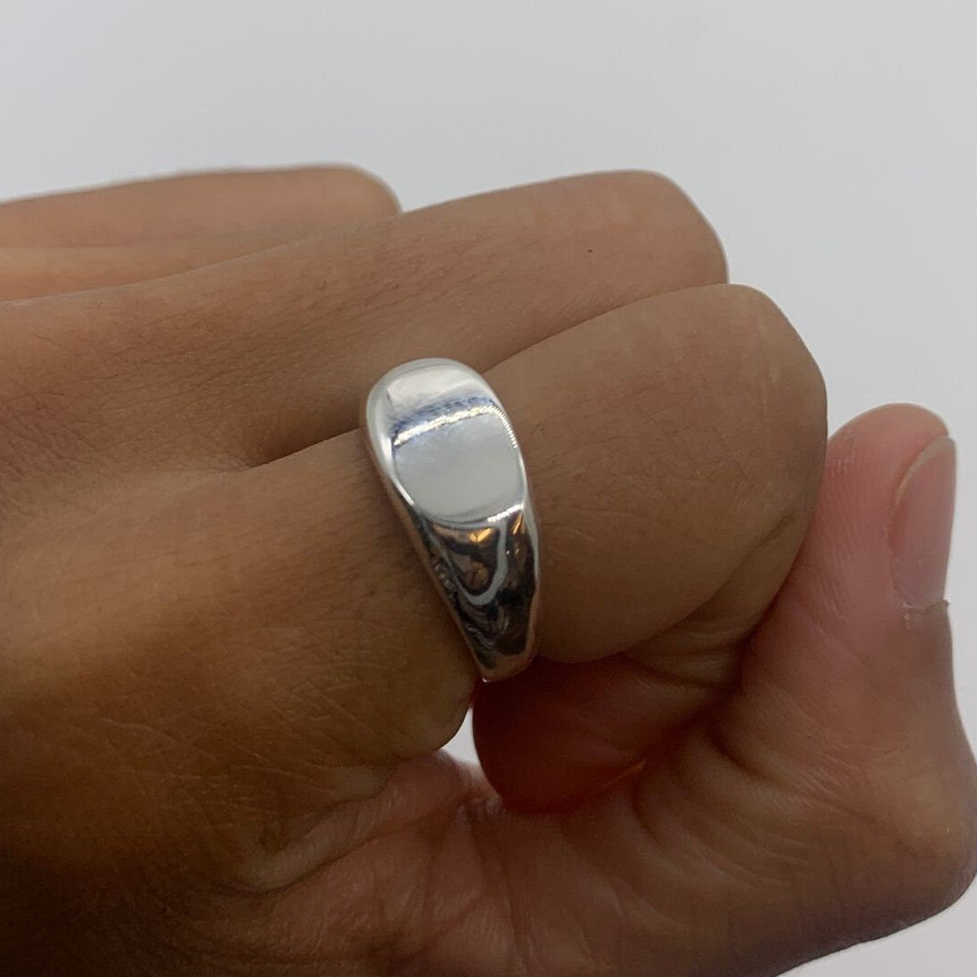 Solid 925 sterling silver ring worn on the thumb, showcasing its bold, statement design.