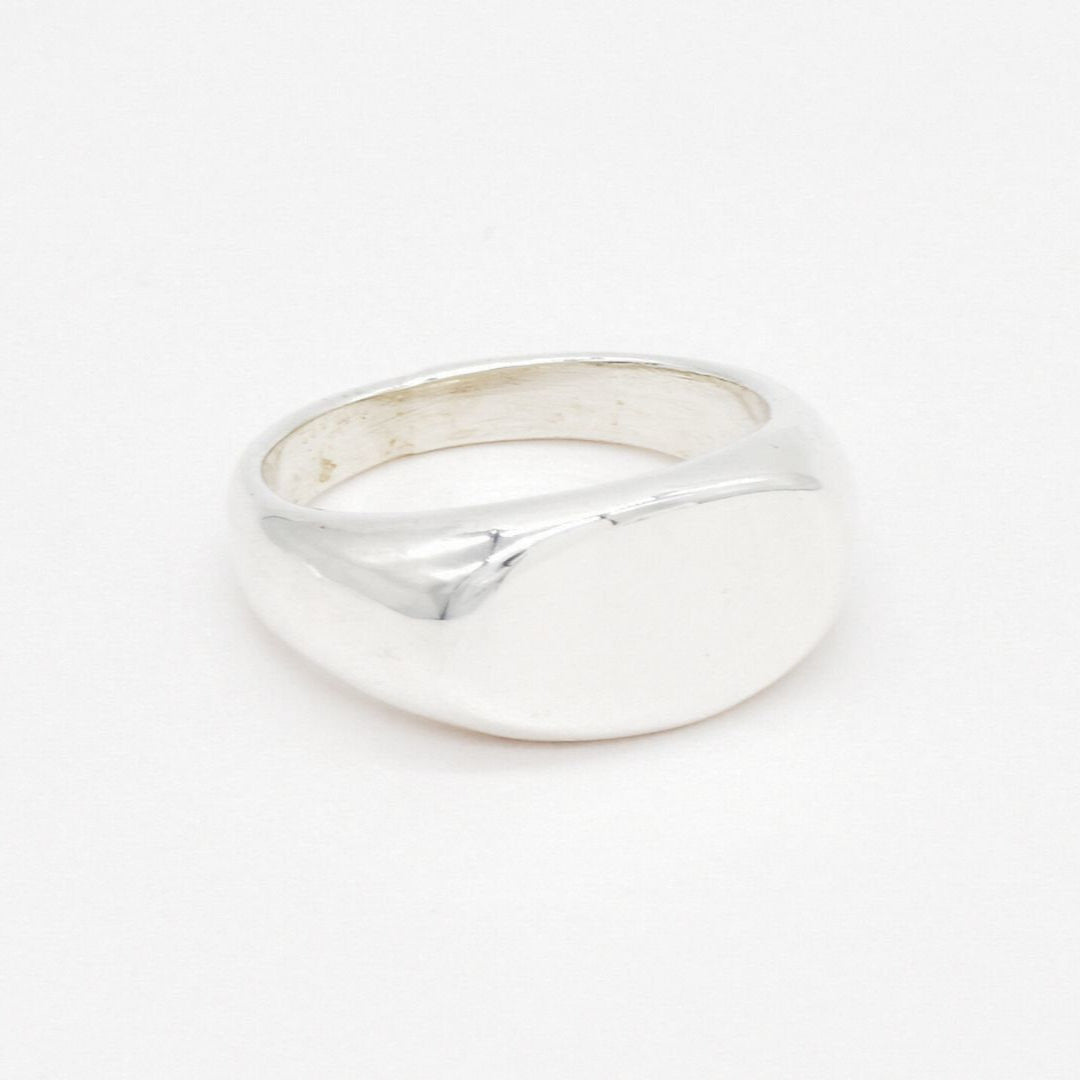 Overhead flat lay of a solid 925 sterling silver ring with a clean, minimalist finish.