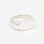 Overhead flat lay of a solid 925 sterling silver ring with a clean, minimalist finish.