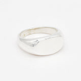 Overhead flat lay of a solid 925 sterling silver ring with a clean, minimalist finish.