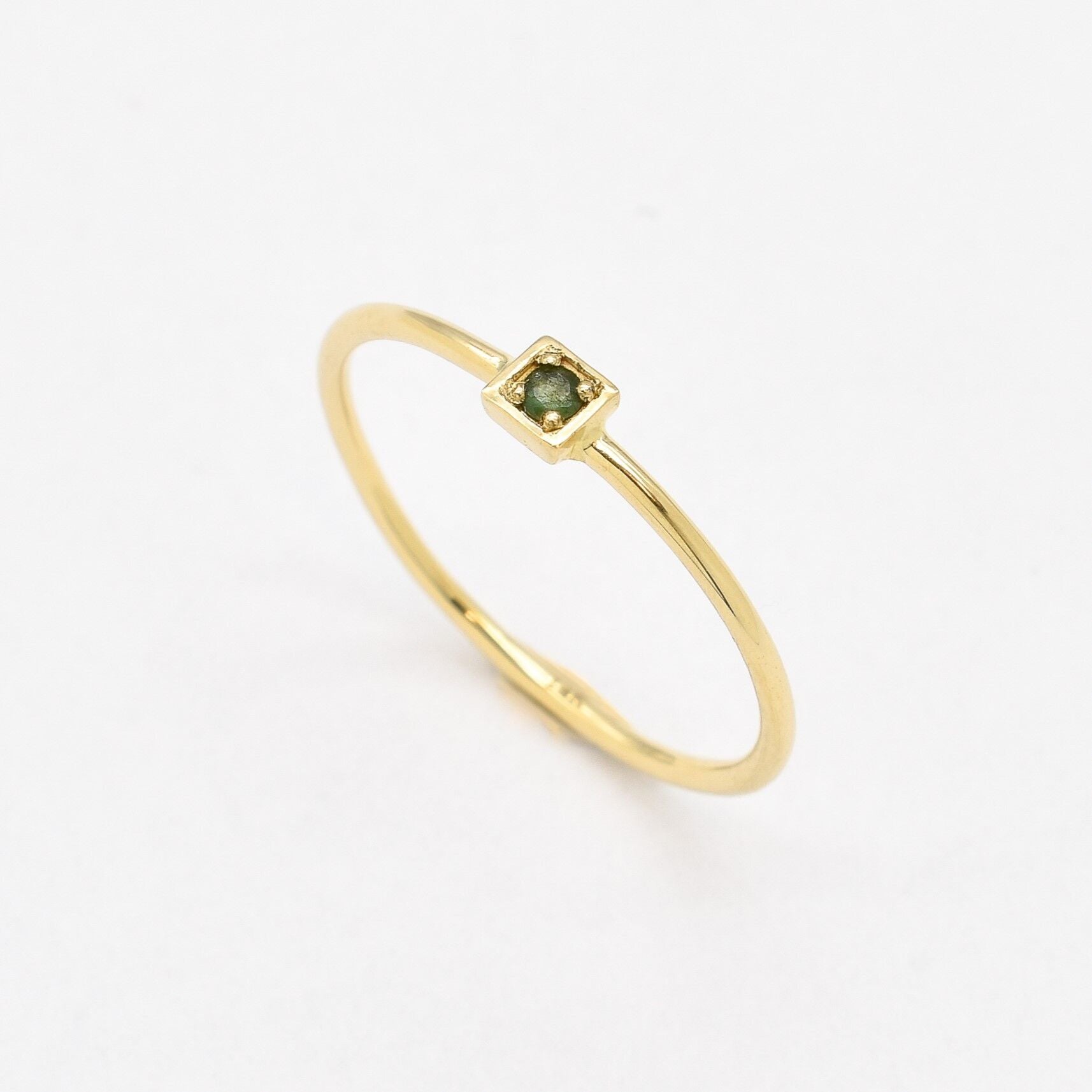 Natural Emerald Ring set in Solid 14k Yellow Gold, in a dainty round cut, and natural green color. May birthstone ring that encourages growth, harmony, and deep emotional healing. Minimalist solid gold ring, perfect for everyday wear, and an ideal may birthday gift idea, or anniversary present.