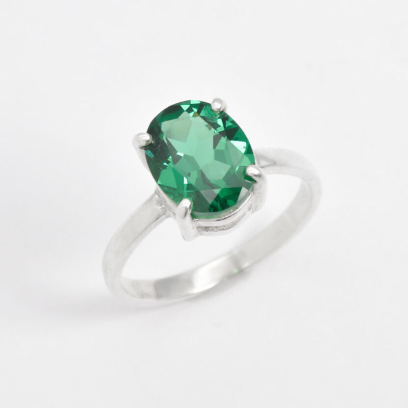 Crafted in 925 Sterling Silver, this Created Emerald Ring features a stunning oval stone, perfect for May birthdays and special moments.