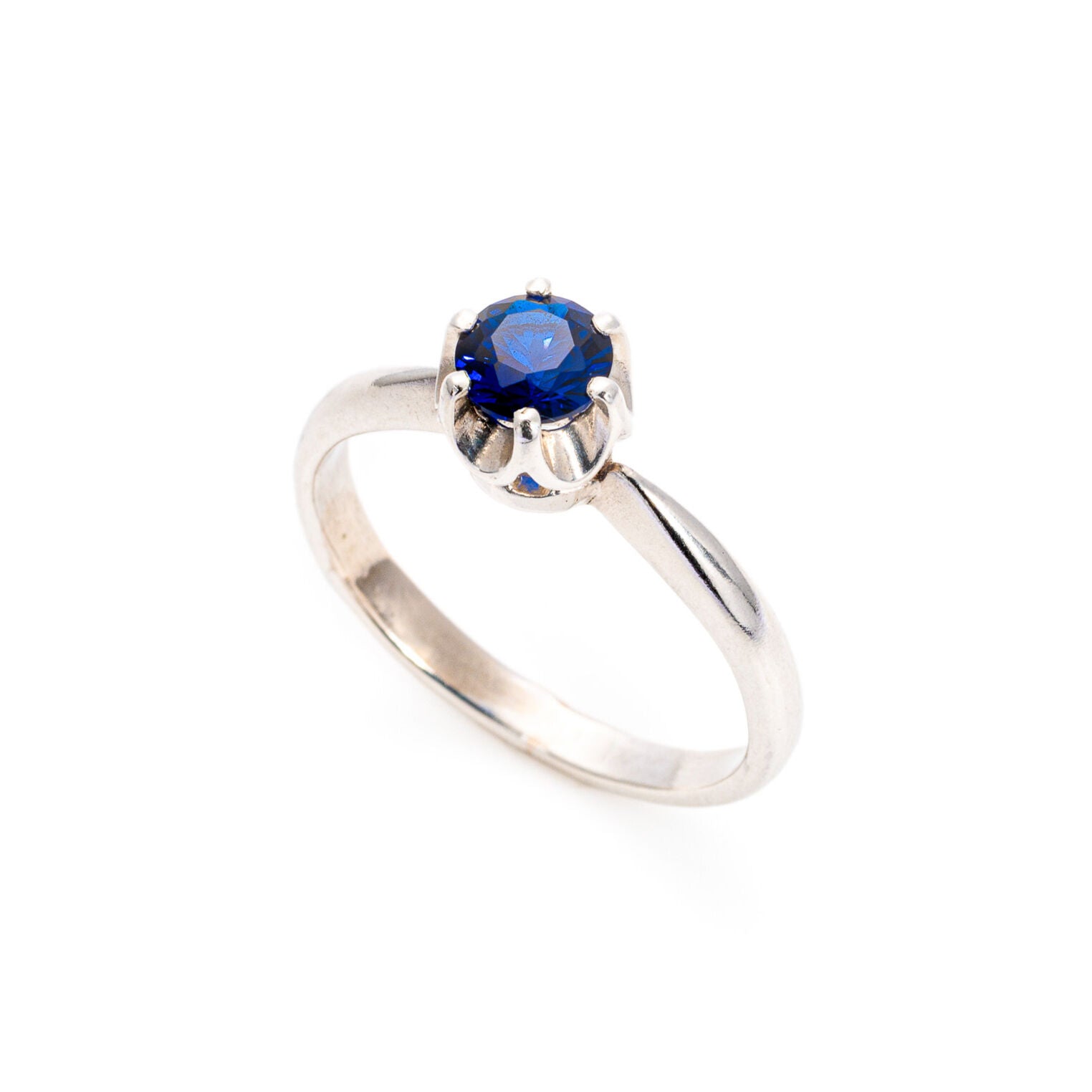 Stylish Sterling Silver ring set with a Round Created Blue Sapphire, symbolizes loyalty and ideal for everyday elegance.