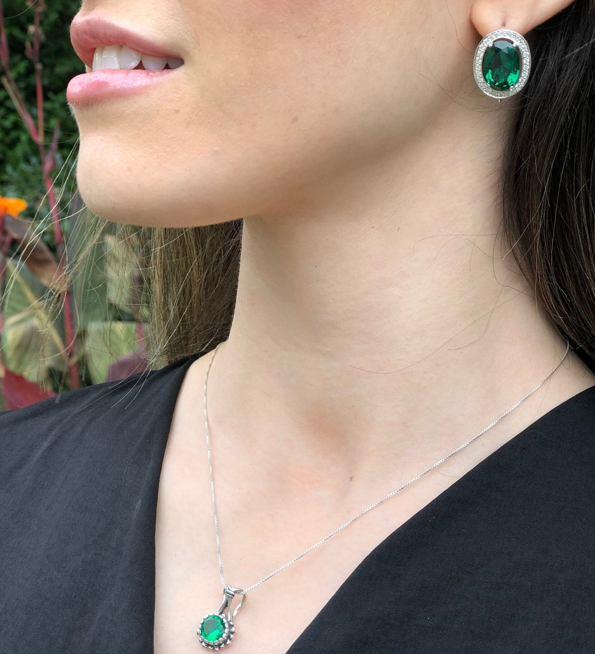 Natural Peridot Necklace styled with a black V-neck and Emerald studs, great for chic garden events or dinner dates.