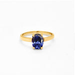 Tanzanite gold ring with 8x6mm deep blue diamond cut gemstone on polished gold band