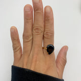 The teardrop Onyx Ring creates a refined silhouette for evening wear.