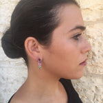 Colorful Tourmaline earrings in multiple shades worn with a casual linen dress, perfect for adding a lively gemstone accent to an easy weekend outfit
