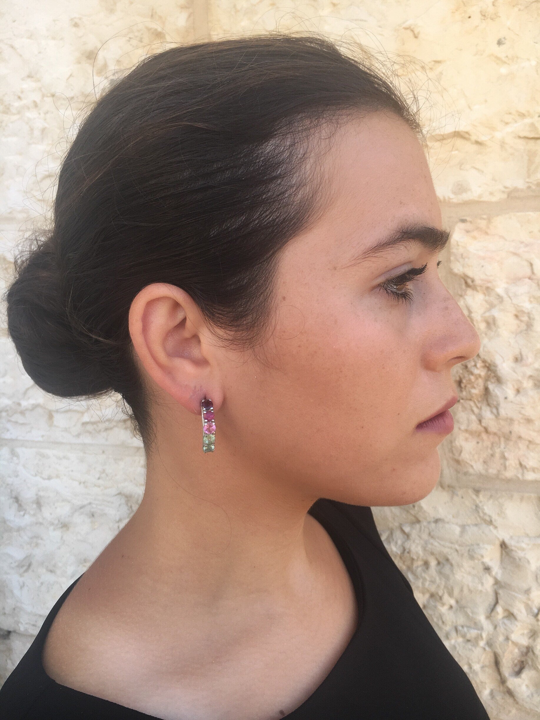 Colorful Tourmaline earrings in multiple shades worn with a casual linen dress, perfect for adding a lively gemstone accent to an easy weekend outfit