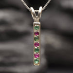 Sterling Silver Natural Emerald Pendant with Channel-Set Green Emerald, symbolizing growth and harmony, perfect for gifts.