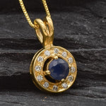 Stunning 18k Gold Vermeil pendant featuring a blue sapphire in a halo design, ideal for special occasions and September birthdays.
