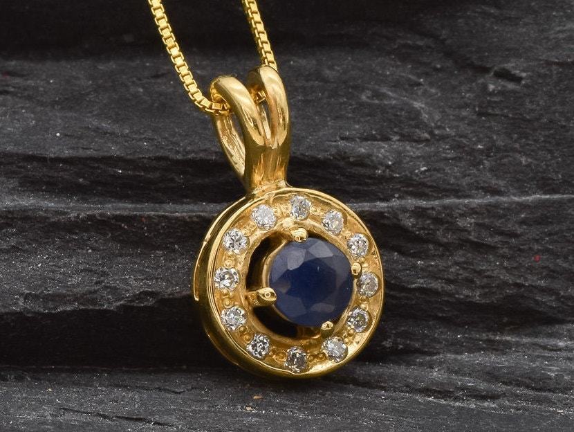 Stunning 18k Gold Vermeil pendant featuring a blue sapphire in a halo design, ideal for special occasions and September birthdays.