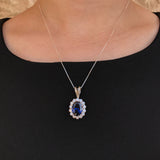 925 Sterling Silver Sapphire Pendant featuring a stunning oval blue sapphire in a halo setting, perfect for special occasions.