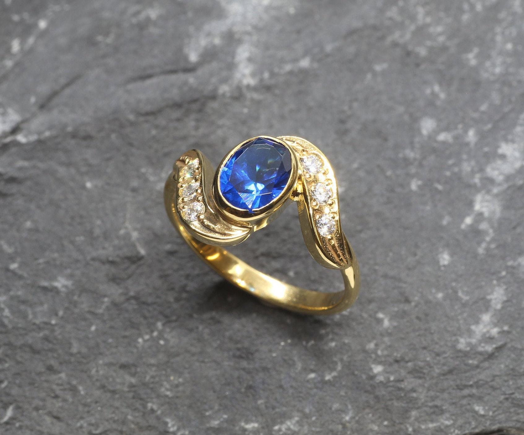 Created Sapphire Ring made in 18k Gold Vermeil with Oval Created Blue Sapphire in Bezel setting, September Birthstone gift idea, symbolizes sincerity, truth, and faithfulness, ideal for everyday wear and perfect for birthday gifting and special occasions.