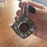 Natural Smoky Topaz pendant with colorful Amethyst, Peridot, and Blue Topaz accents in a bold geometric setting, perfect for statement lovers