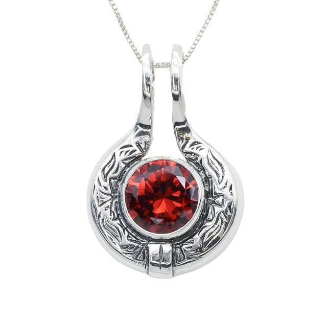 Ruby pendant with vintage-style engravings, perfect for statement looks. Symbolizes passion and energy. A unique birthday or love gift. Ideal for anniversaries.