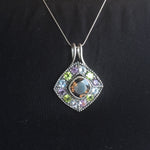 Smoky Topaz statement pendant worn over a black crew neck top—adds vivid contrast and bold sparkle, perfect for elegant casual days